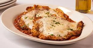Carmine's signature dishes Chicken Parmigiana, Rigatoni with Sausage and Broccoli, Penne alla Vodka, Veal Saltimbocca, Titanic Sundae.